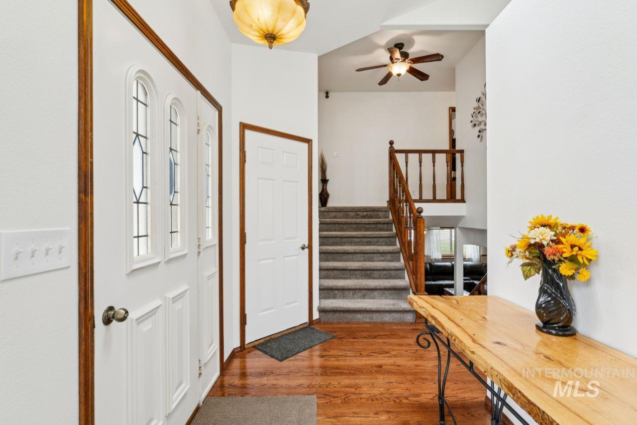 710 Keogh Lane Caldwell, ID 83607 - Photo 13 of 50 Foyer featuring dark wood finished floors and ceiling fan