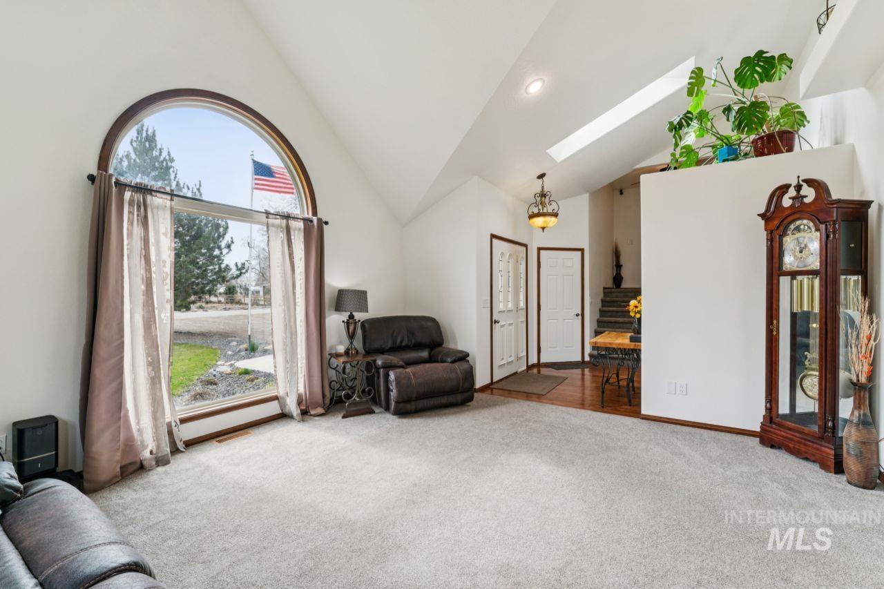 710 Keogh Lane Caldwell, ID 83607 - Photo 15 of 50 Sitting room featuring a skylight, carpet, recessed lighting, and vaulted ceiling