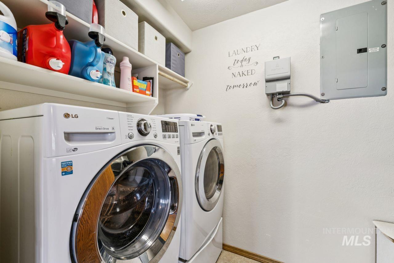 710 Keogh Lane Caldwell, ID 83607 - Photo 35 of 50 Laundry area featuring electric panel and washer and dryer