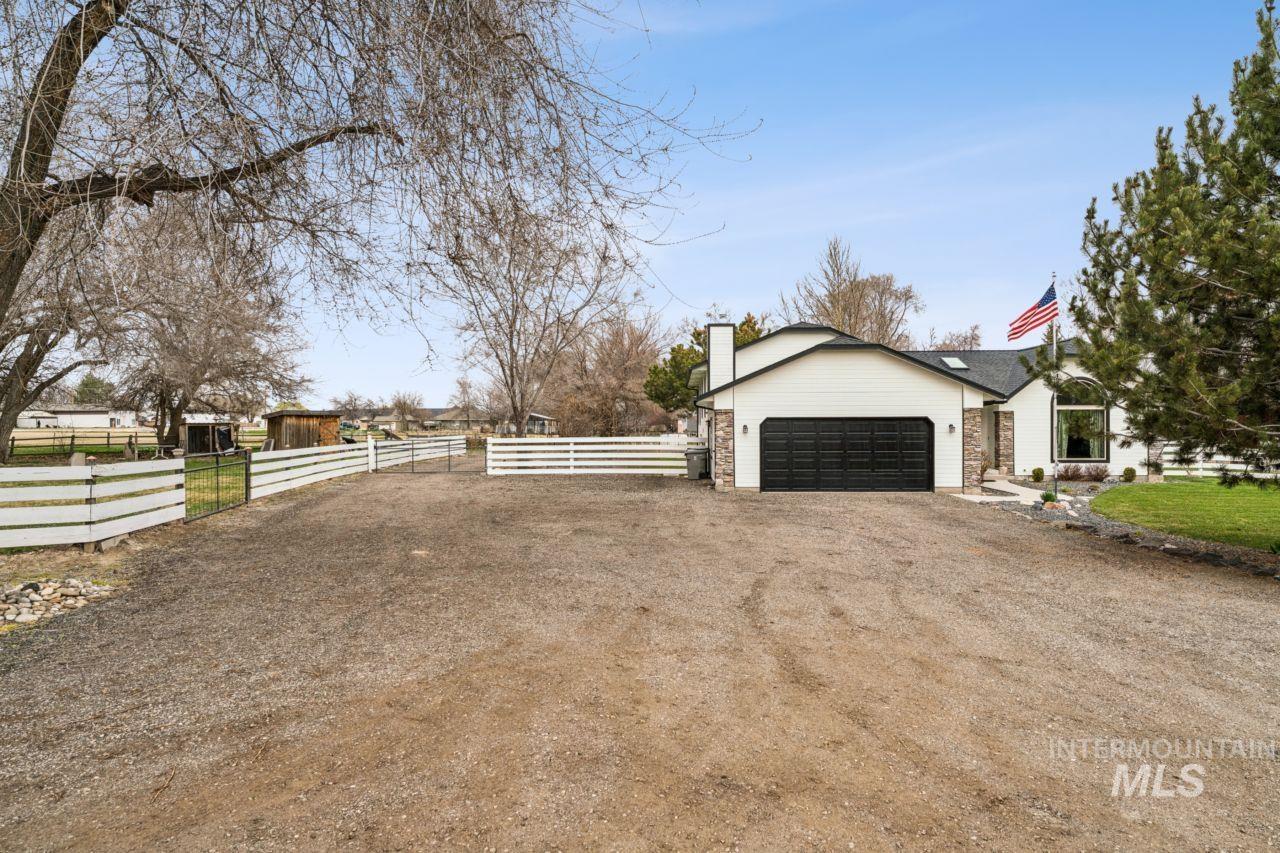 710 Keogh Lane Caldwell, ID 83607 - Photo 37 of 50 View of side of property featuring dirt driveway and a chimney