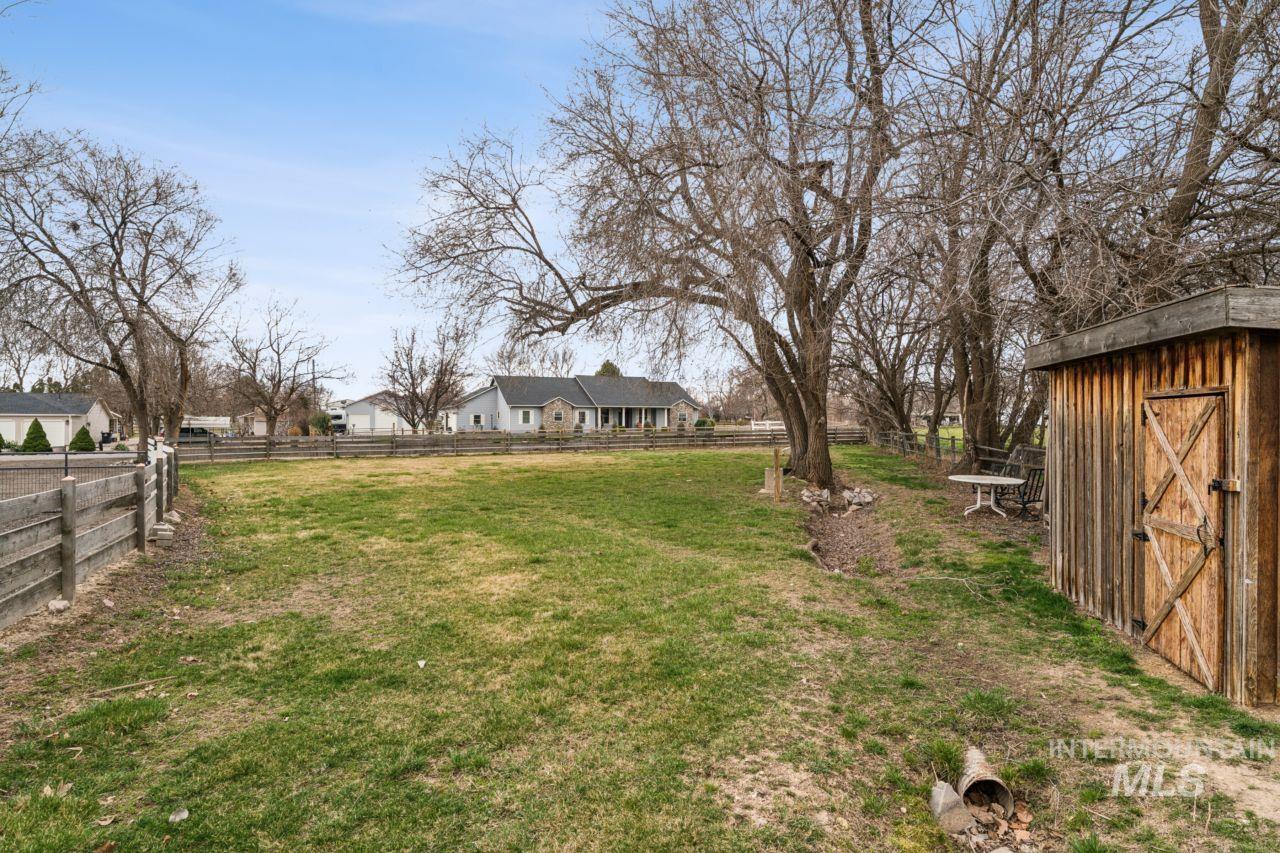 710 Keogh Lane Caldwell, ID 83607 - Photo 39 of 50 Fenced yard featuring a storage shed
