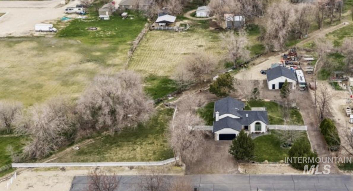710 Keogh Lane Caldwell, ID 83607 - Photo 7 of 50 Aerial view of property and surrounding area featuring rural landscape