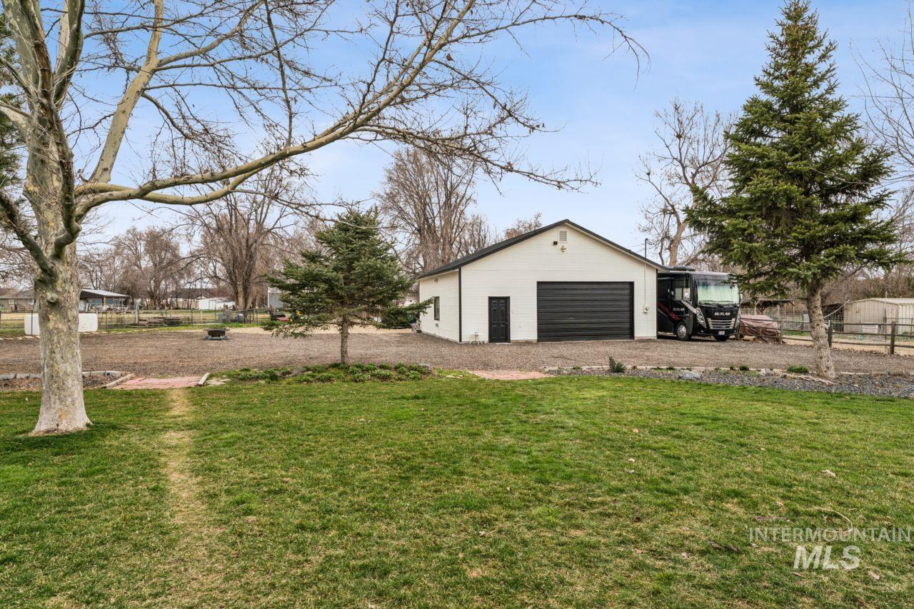 710 Keogh Lane Caldwell, ID 83607 - Photo 9 of 50 View of yard featuring an outdoor structure and driveway