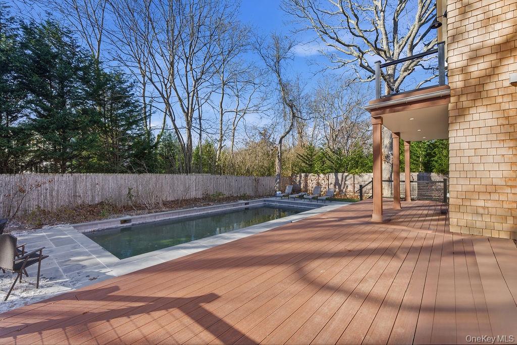 768 Bridgehampton Sag Harbor Bridgehampton, NY 11932 - Photo 9 of 35 View of pool with a fenced backyard, a wooden deck, and a patio