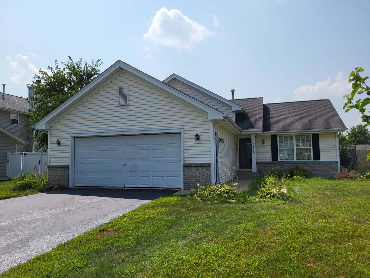 614 Bayfield Road Rockton, IL 61072 - Photo 1 of 42 a front view of a house with a yard and garage
