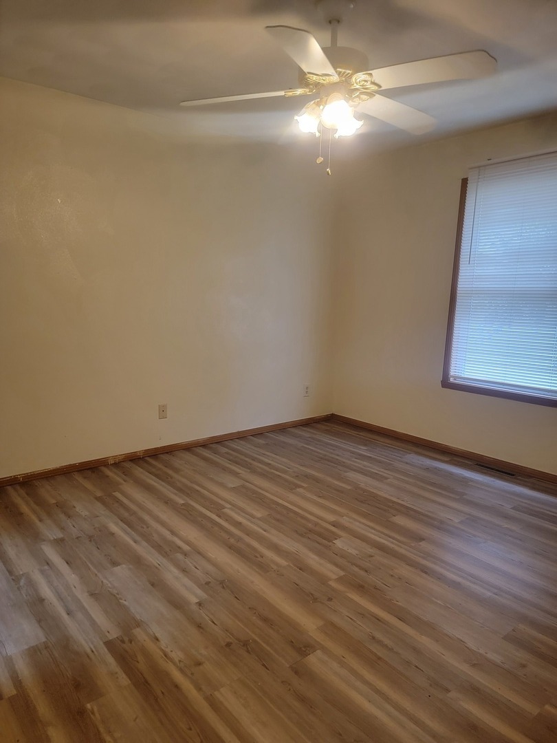 614 Bayfield Road Rockton, IL 61072 - Photo 13 of 42 a view of empty room with wooden floor
