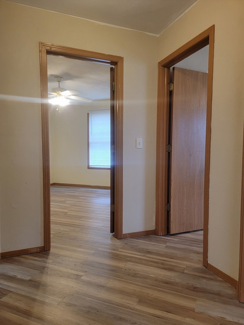 614 Bayfield Road Rockton, IL 61072 - Photo 18 of 42 a view of a hallway with wooden floor