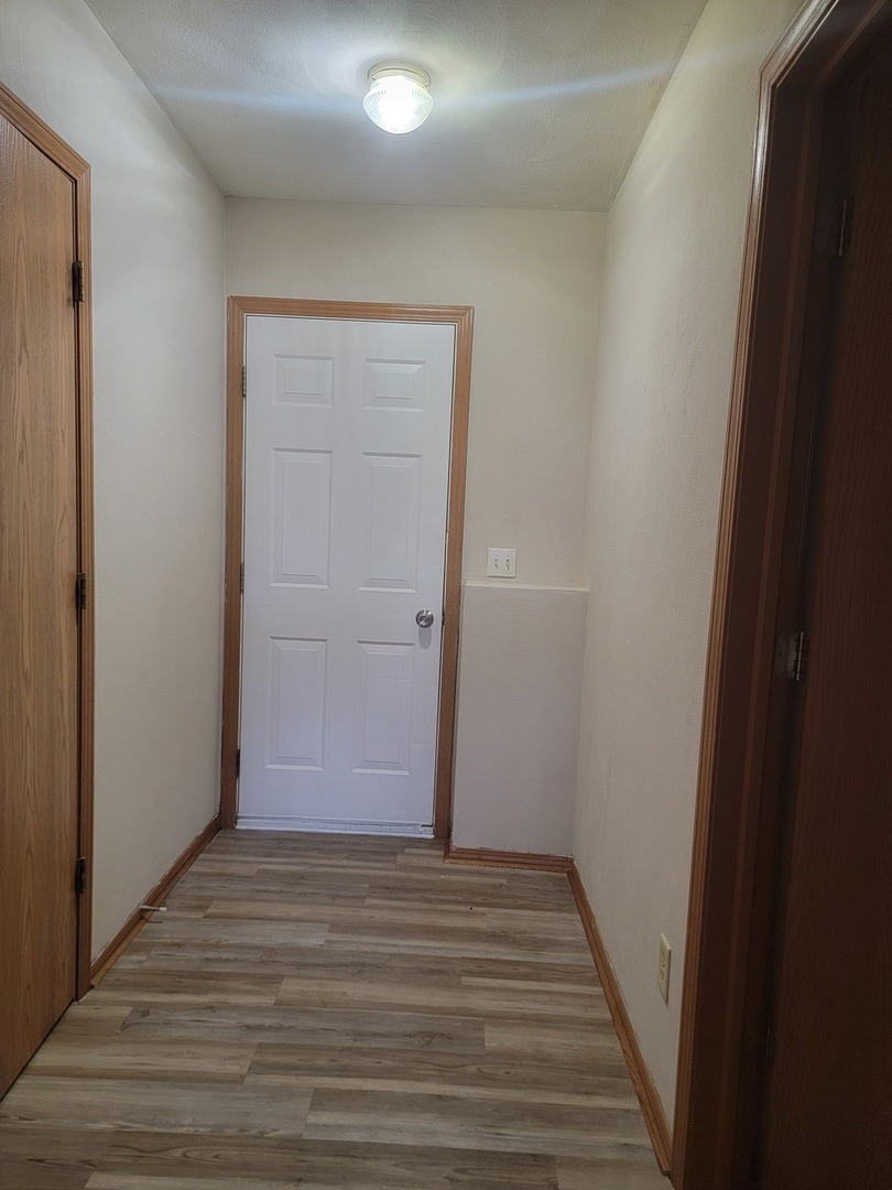614 Bayfield Road Rockton, IL 61072 - Photo 23 of 42 an empty room with wooden floor