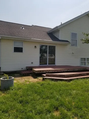 a view of a swimming pool with an outdoor space and seating area