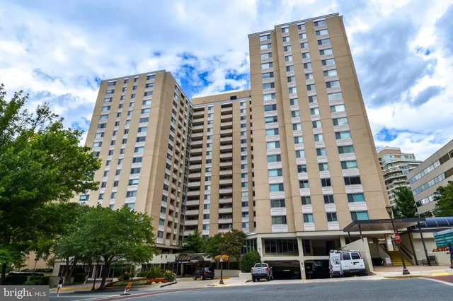 a view of a house with swimming pool and a porch