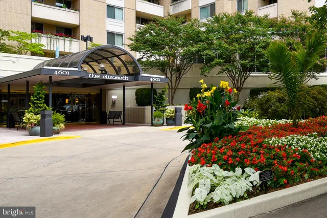 a living room with furniture a window and a dining table