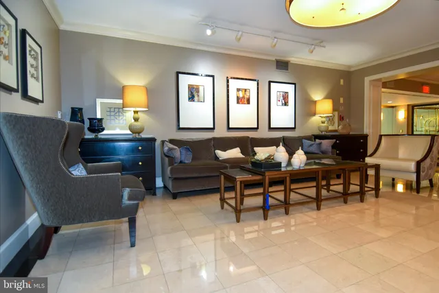 a view of a patio with table and chairs potted plants and large tree