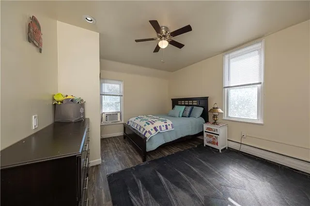 a bedroom with a bed and window