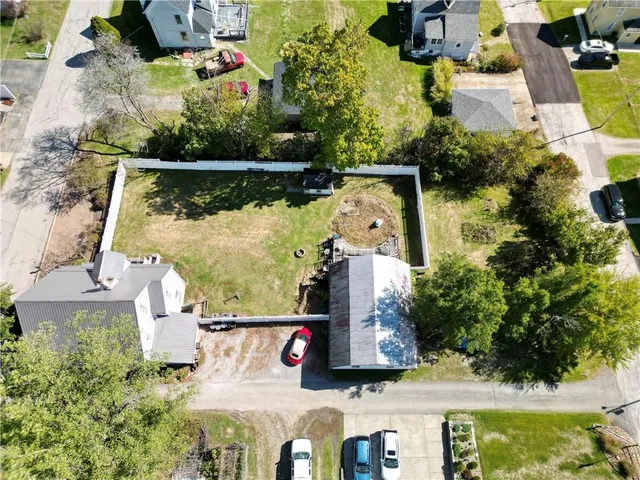 an aerial view of houses with yard