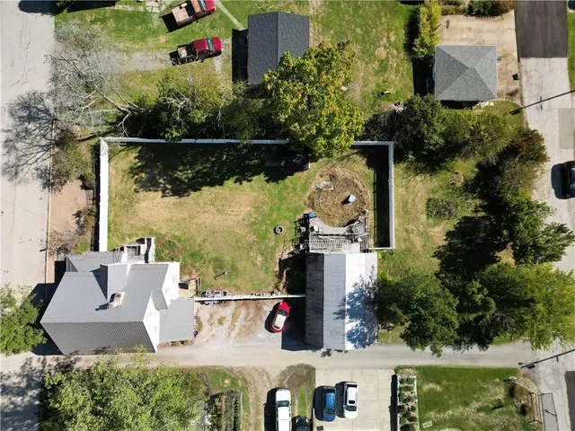 an aerial view of houses with outdoor space