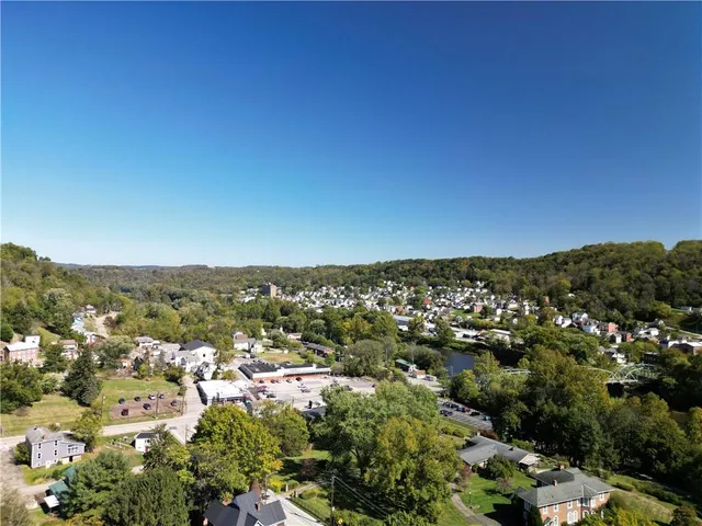an aerial view of a residential houses and city view