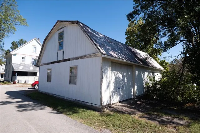 a view of living room kitchen and entryway