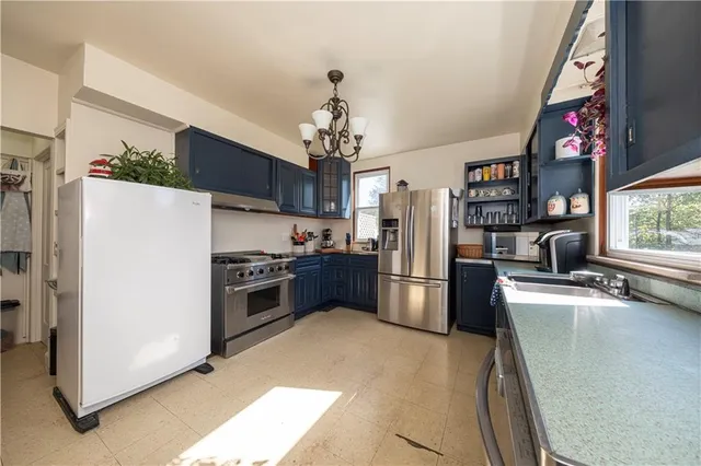 a kitchen with refrigerator and window