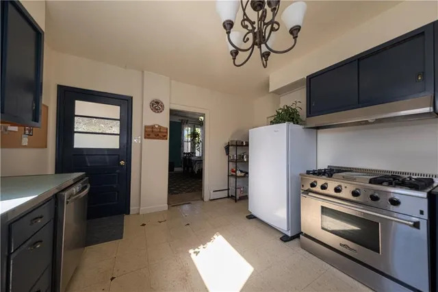 a kitchen with a stove and a refrigerator