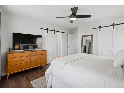 a bedroom with a bed and a dresser