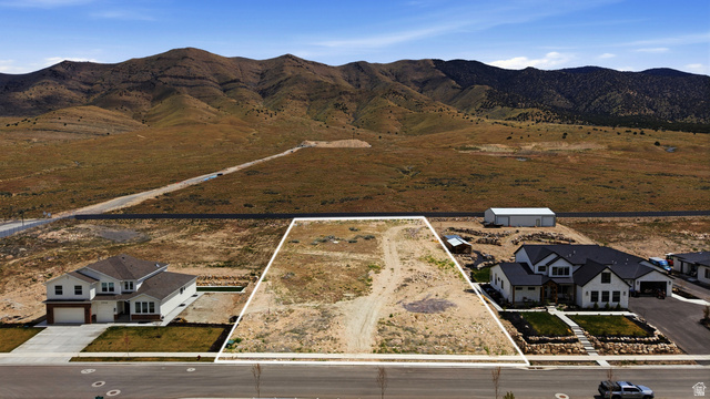 2930 Jojo Road, Unit 110 Eagle Mountain, UT 84005 - Photo 1 of 22 Overview of rural landscape featuring property parcel outlined and a mountainous background