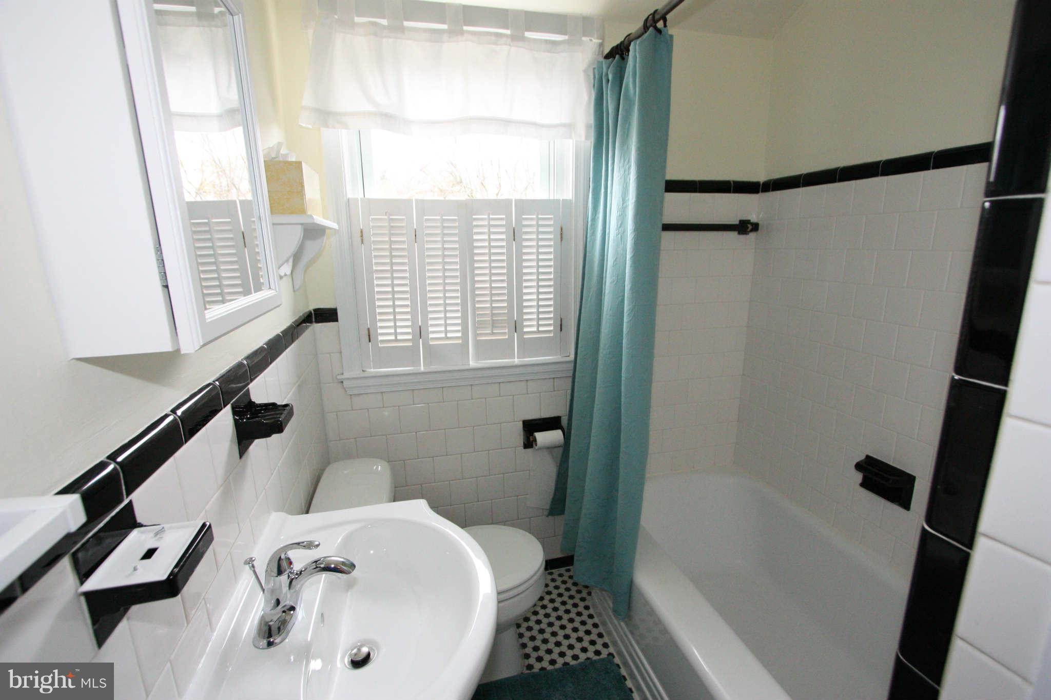 1606 Aberdeen Road Towson, MD 21286 - Photo 15 of 30 a bathroom with a bathtub and a shower