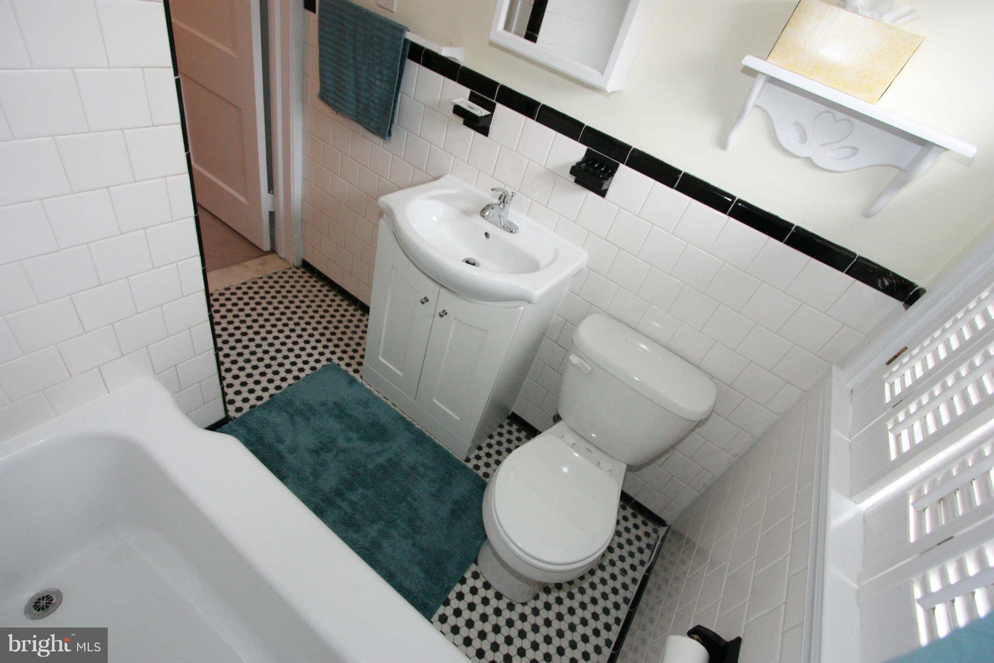 1606 Aberdeen Road Towson, MD 21286 - Photo 17 of 30 a bathroom with a sink toilet and mirror