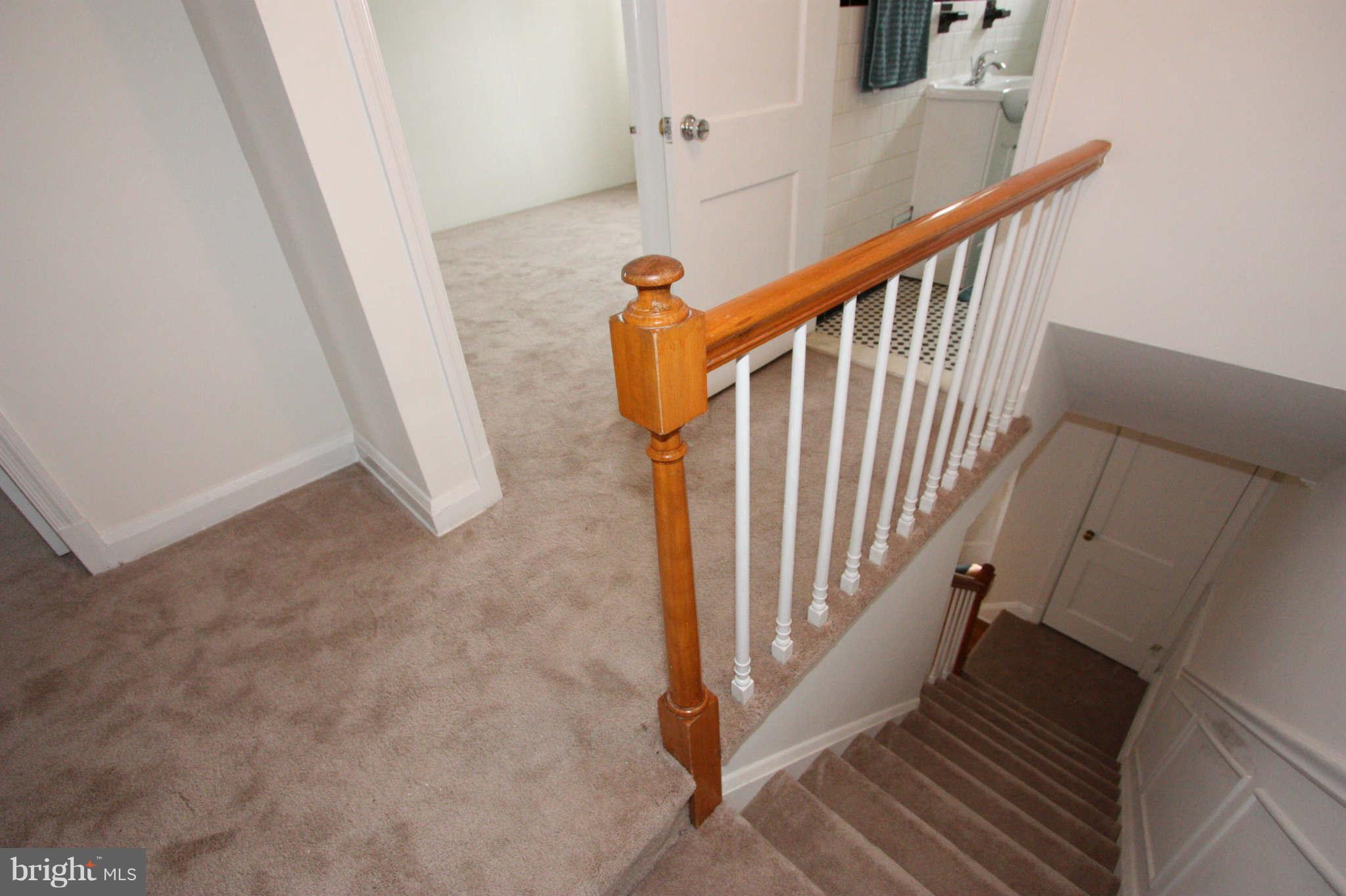 1606 Aberdeen Road Towson, MD 21286 - Photo 20 of 30 a view of staircase with railing and white walls