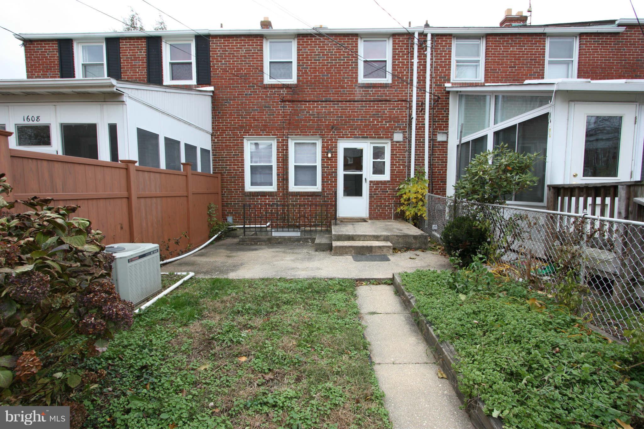 1606 Aberdeen Road Towson, MD 21286 - Photo 25 of 30 front view of a brick house with a yard