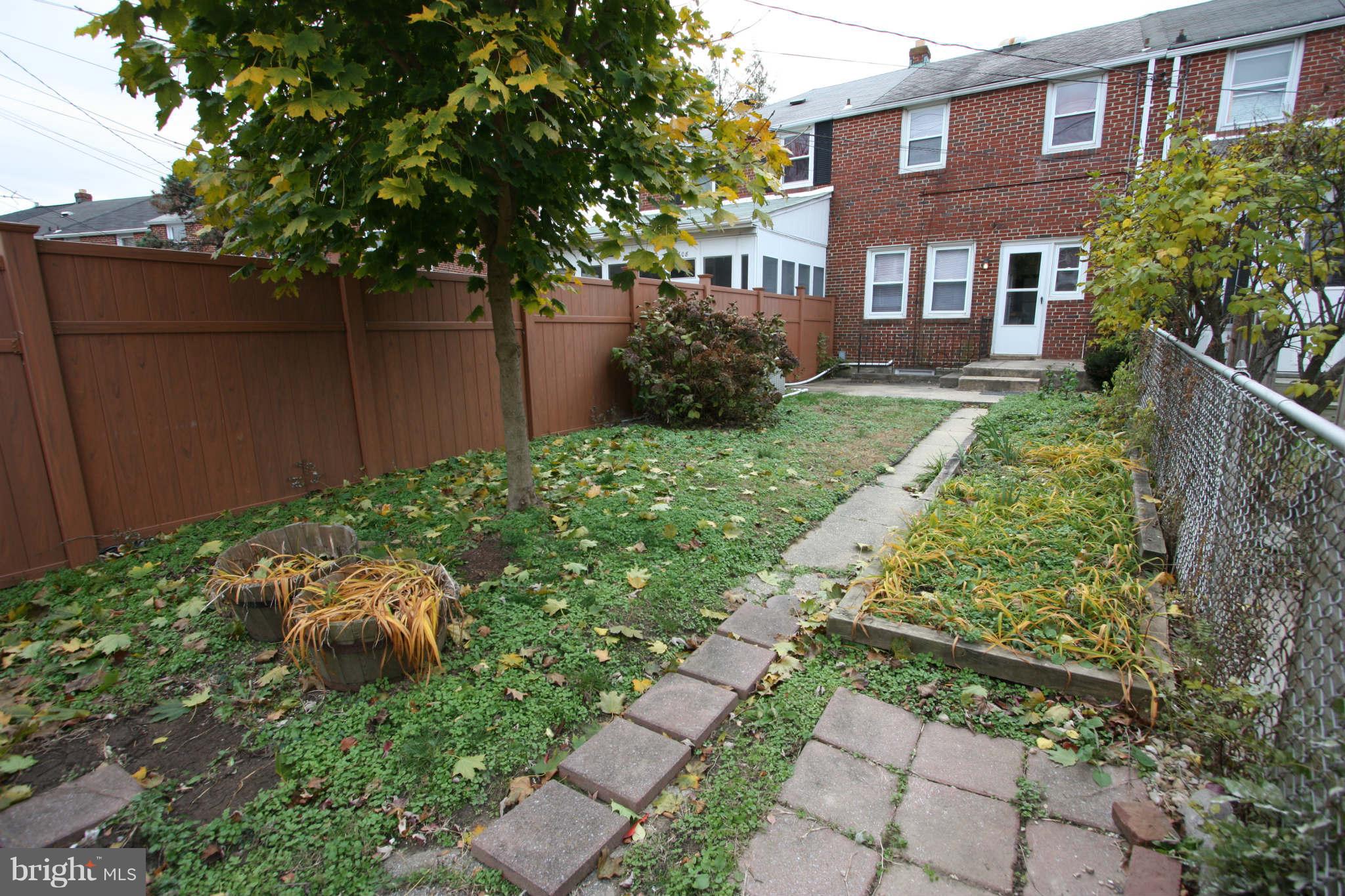 1606 Aberdeen Road Towson, MD 21286 - Photo 26 of 30 a backyard of a house with a garden and plants