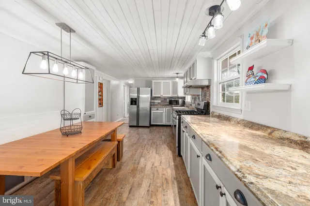 a kitchen with a stove and a sink