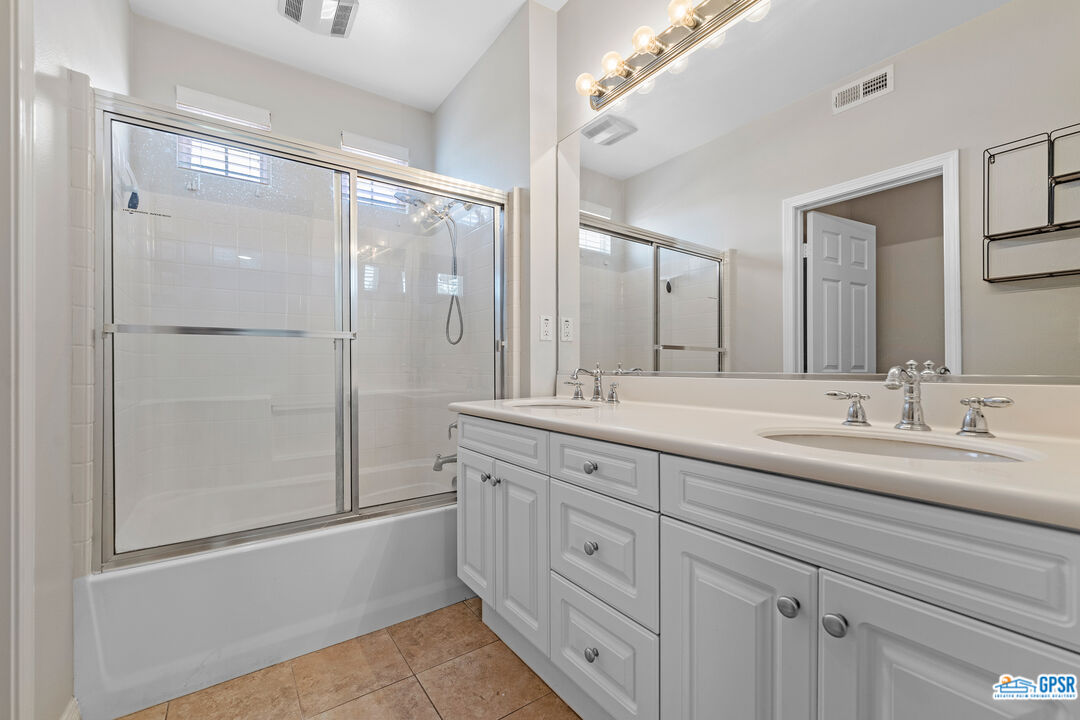 22 Paseo Rosa San Clemente, CA 92673 - Photo 17 of 24 a bathroom with a double vanity sink and mirror with shower