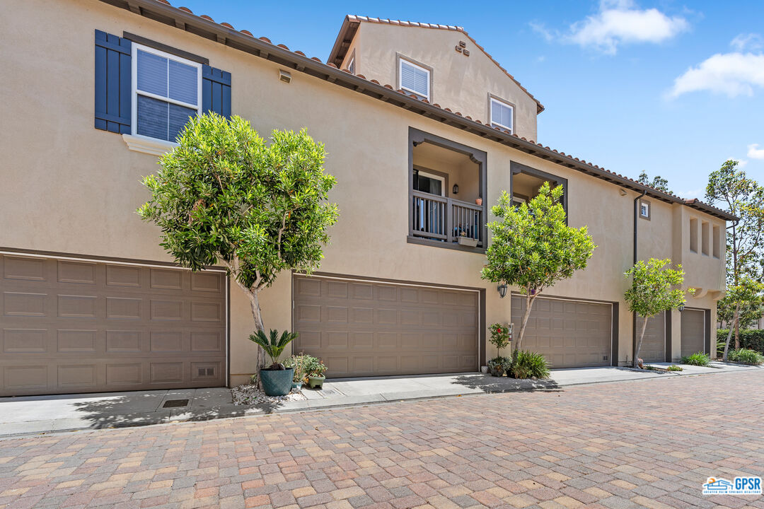 22 Paseo Rosa San Clemente, CA 92673 - Photo 20 of 24 a front view of a house with a yard and garage