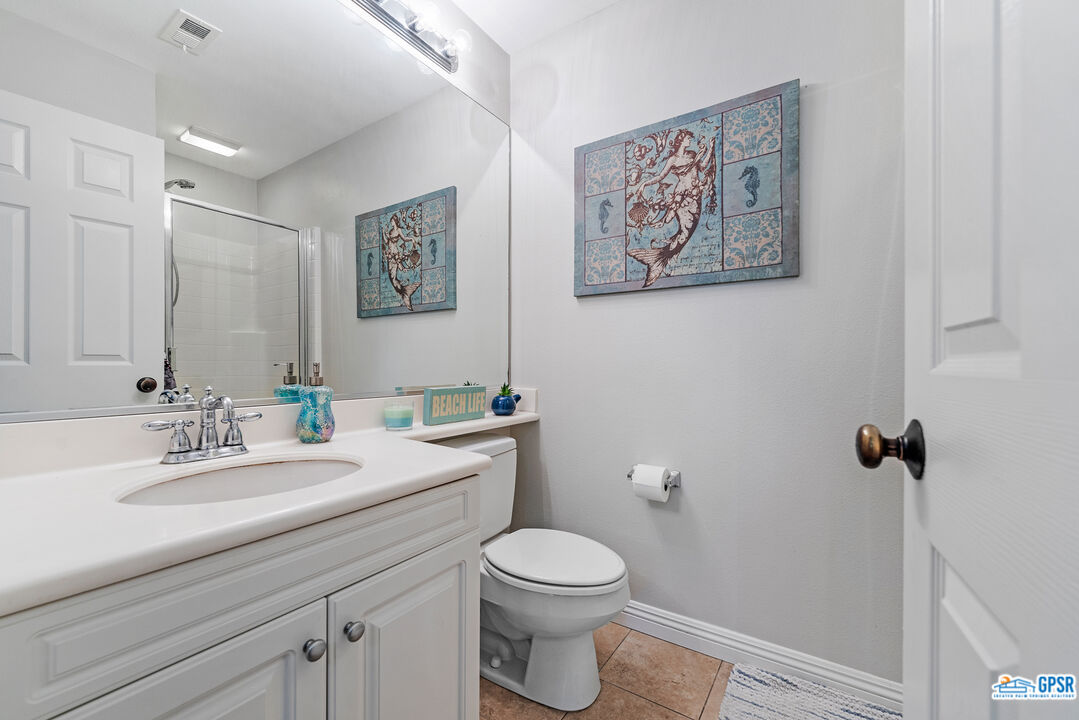 22 Paseo Rosa San Clemente, CA 92673 - Photo 6 of 24 a bathroom with a toilet sink and mirror