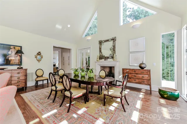 a dining room with furniture and a fireplace