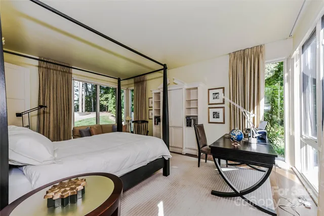 a bedroom with furniture and windows