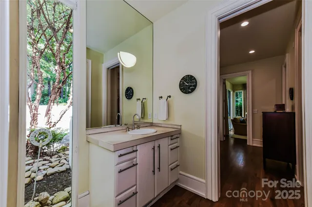 a view of hallway with wooden floor