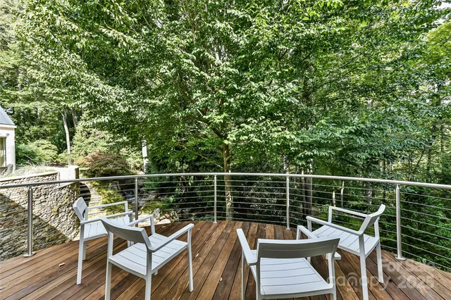a view of a chairs and table on the deck
