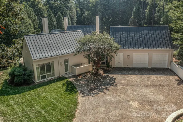 a side view of a house with a yard