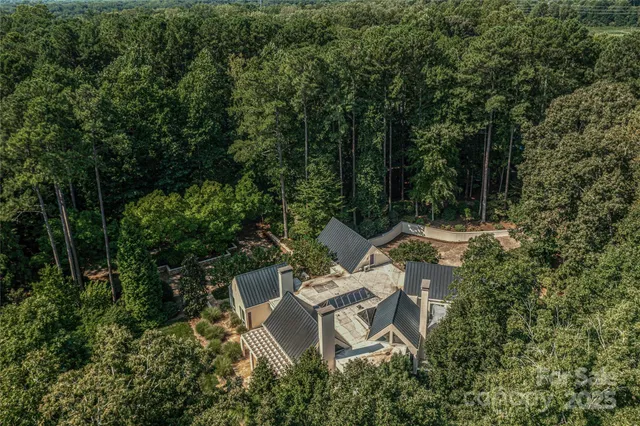 a view of backyard with outdoor seating and green space
