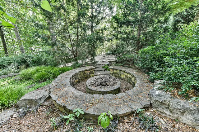a view of a backyard with a fountain