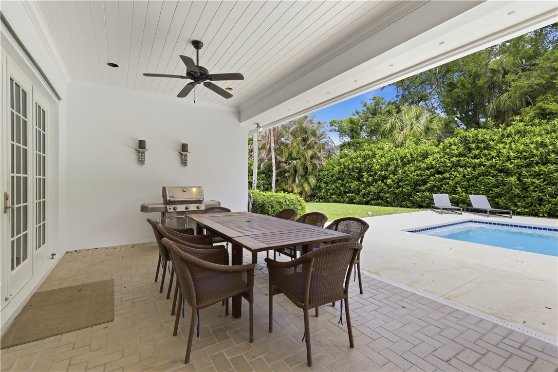 2116 Cavalla Road Vero Beach, FL 32963 - Photo 18 of 23 a view of a patio with a table and chairs