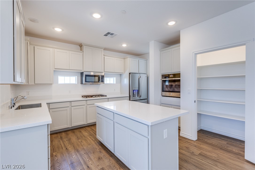 2555 Hampton Road, Unit 8206 Henderson, NV 89052 - Photo 10 of 25 A well-equipped kitchen showcasing a central island and a convenient walk-in pantry.