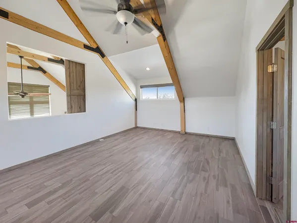 a view of an entryway with wooden floor