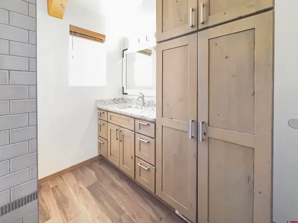 a view of a kitchen from the hallway