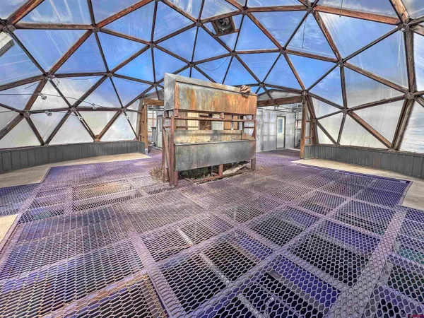 a view of a house with a wooden fence