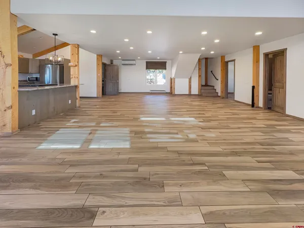 a view of a kitchen and a room