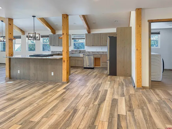 a view of a kitchen from the hallway