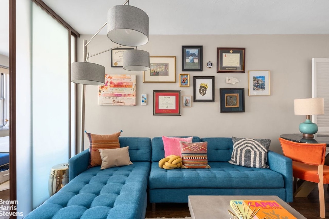 205 3rd Avenue, Unit 17L Manhattan, NY 10003 - Photo 3 of 10 a living room with furniture