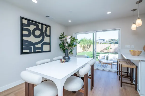 a kitchen with cabinets stainless steel appliances and a sink